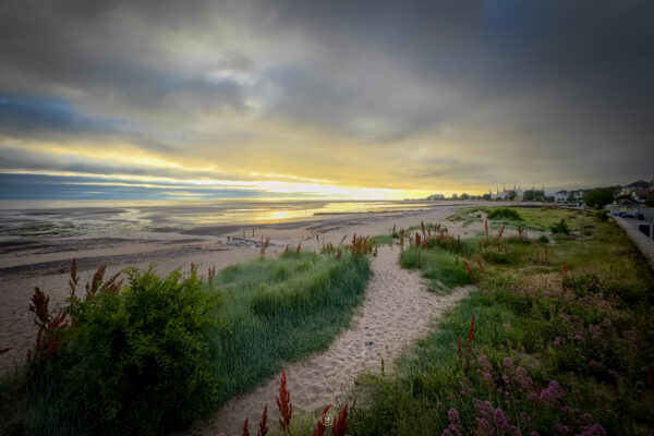 Dawn’s Whisper: Sunrise Over Minehead Beach